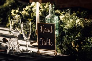 Take sign reading Head table